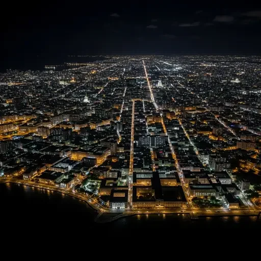 Aerial view of Havana neighborhoods in darkness during the March 2026 blackout, with scattered emergency lighting visible near hospitals